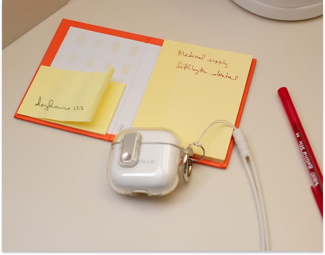 An open notebook and organized medical supplies.