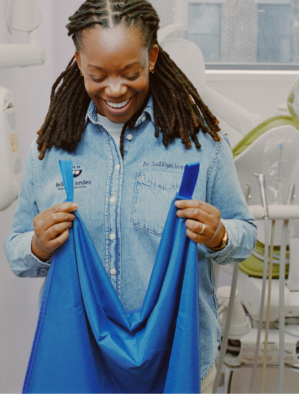 Smiling care professional in a bright workplace.